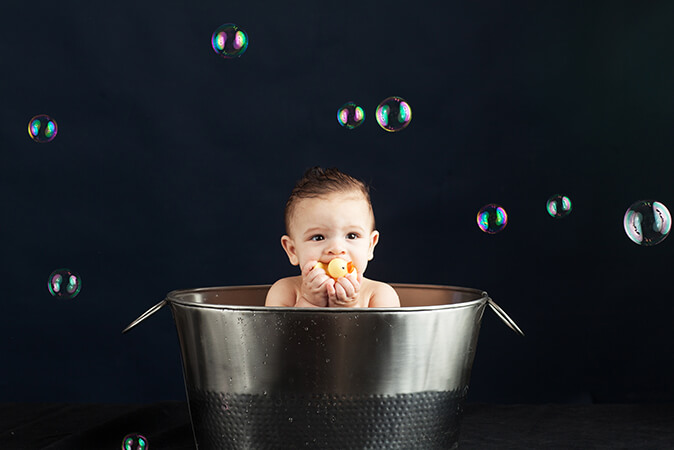 baby taking the bath bubbles studio photo shoot